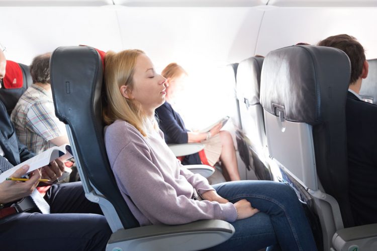 Woman sleeping on a plane