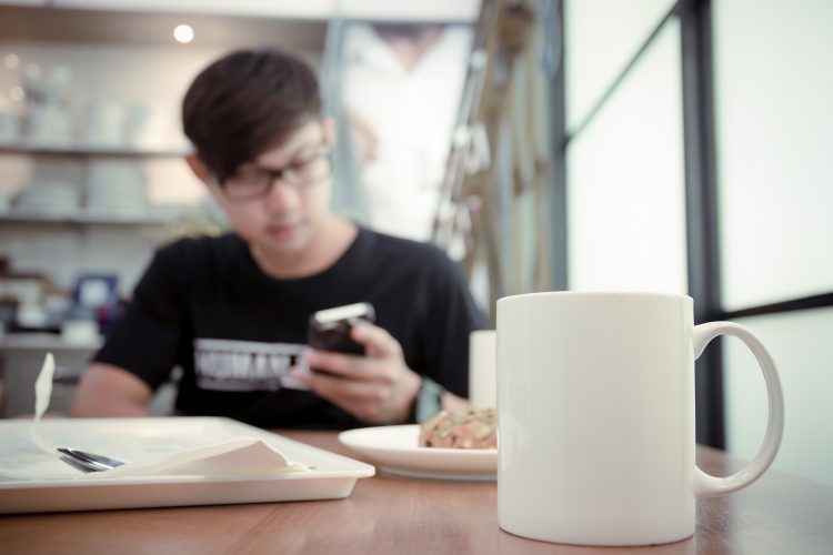 Young man in coffee shop