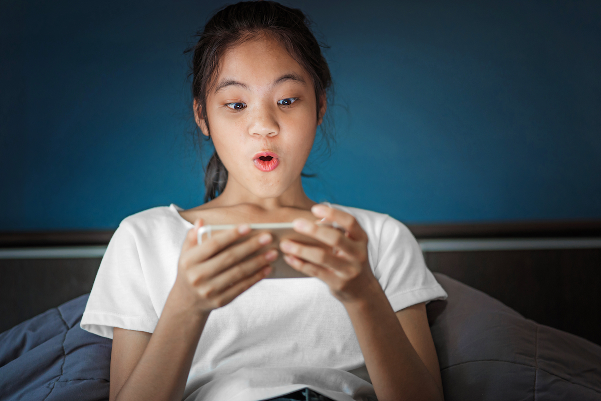 Teen looking at cell phone